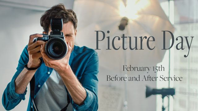 In the Photo Studio with Professional Equipment: Portrait of the Famous Photographer Holding State of the Art Camera Taking Pictures with Softboxes Flashing in Background.
