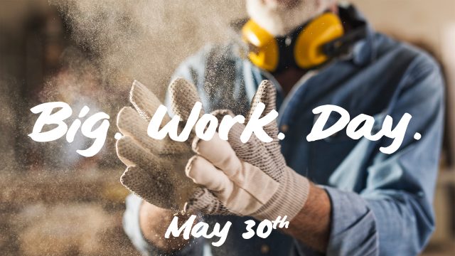 Unrecognizable male hands with work gloves on, clapping to remove sawdust